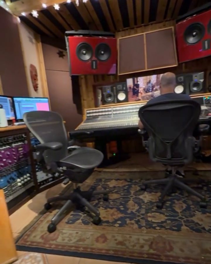 Studio A at Phat Planet: the console, red main monitors and string lights