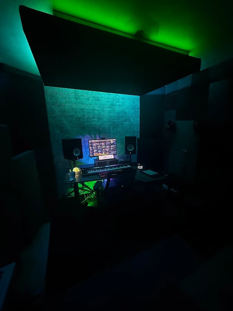 The ZDUB room lit green, with the hanging ceiling cloud over the desk